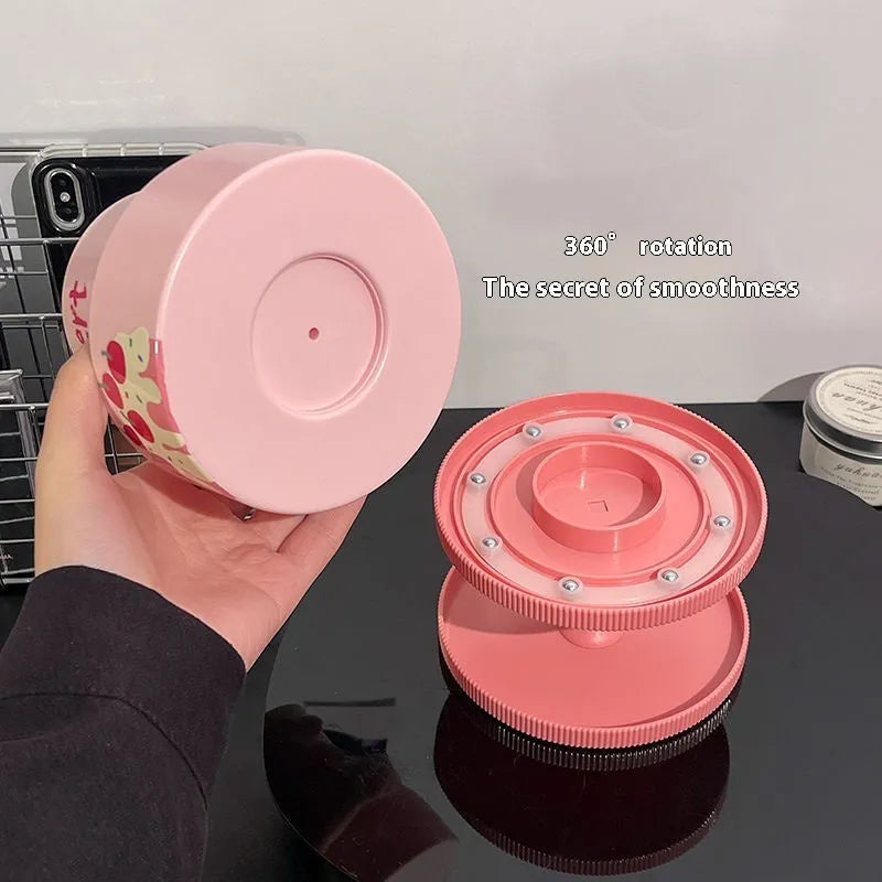 Rotating beige cosmetic brush storage barrel with 18-litre capacity on a table.