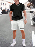 Man wearing a grey short-sleeved sports top and matching shorts from a quick-dry two-piece set.