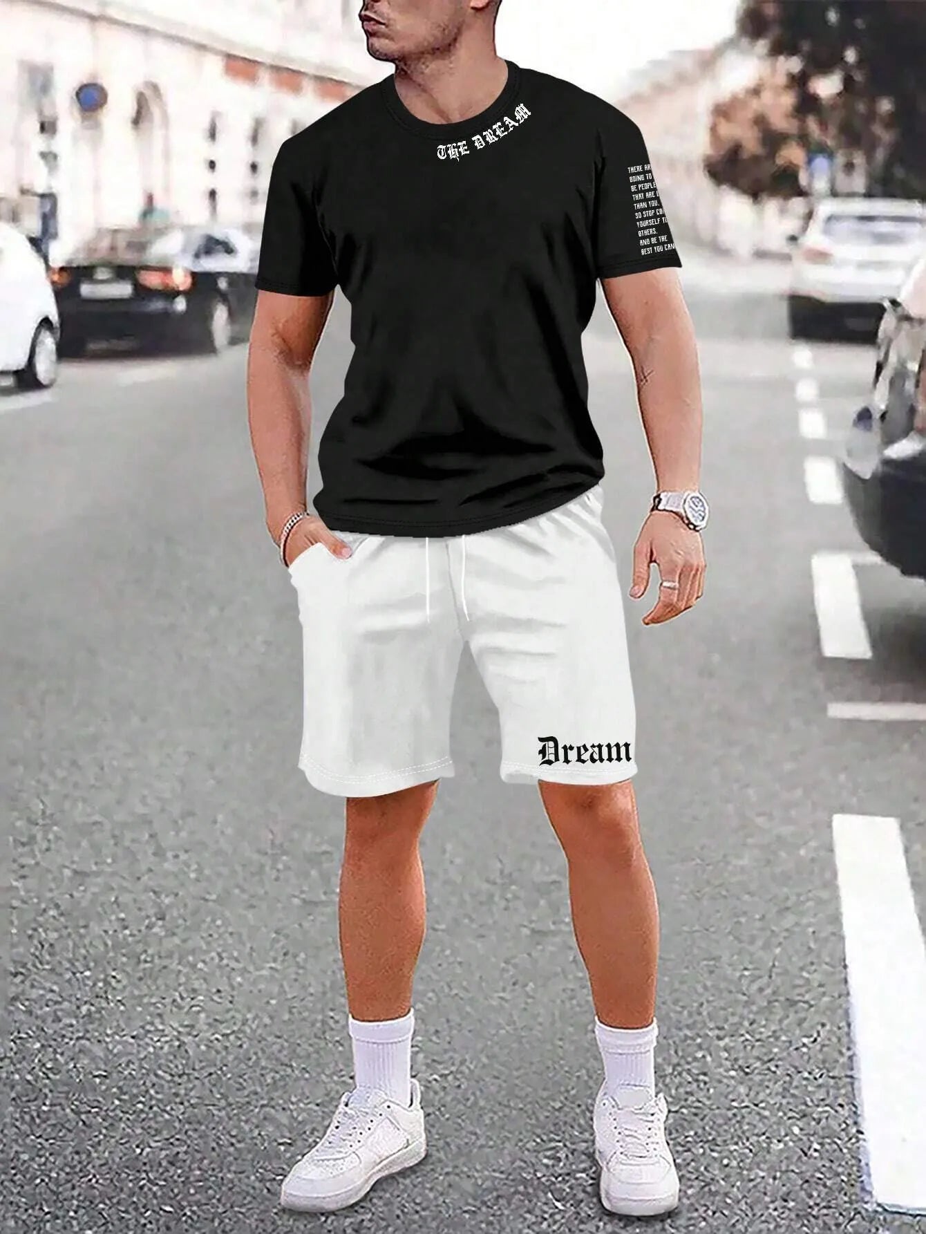 Man wearing a grey short-sleeved sports top and matching shorts from a quick-dry two-piece set.