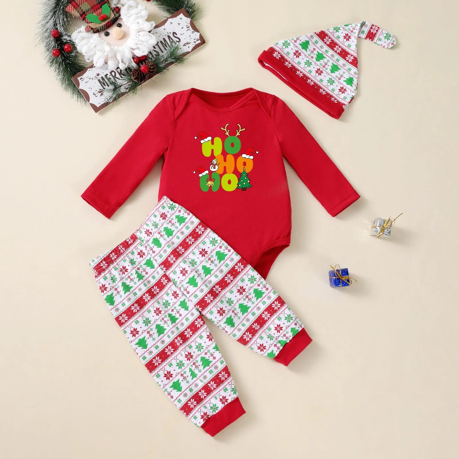 Christmas tree print three-piece baby outfit with bodysuit pants and hat on white background