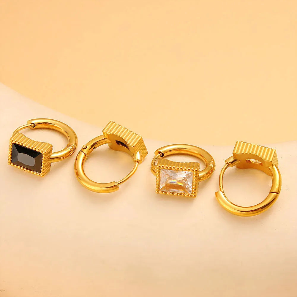 Geometric stainless steel earrings with a square zircon, available in white, black and green.