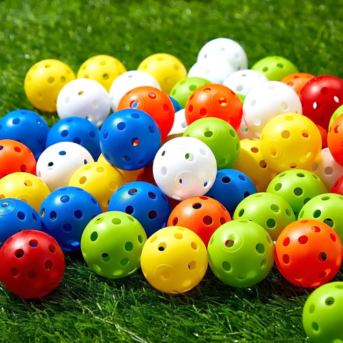 Assorted multi-colour 42mm golf practice balls with a net bag, shown next to practice putting holes.