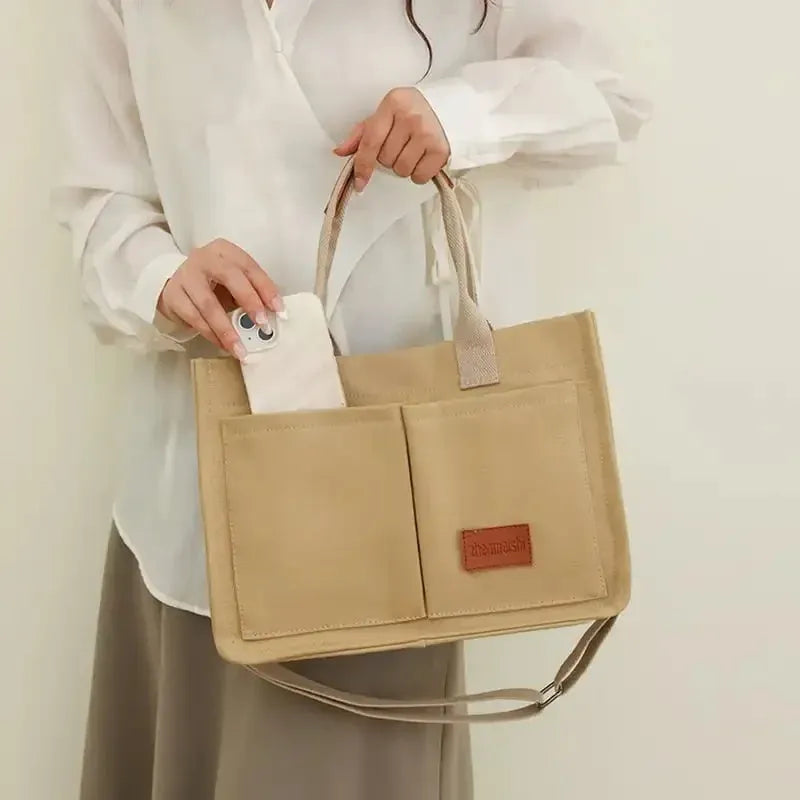 Large capacity canvas tote bag for women with multiple pockets and crossbody strap in creamy white