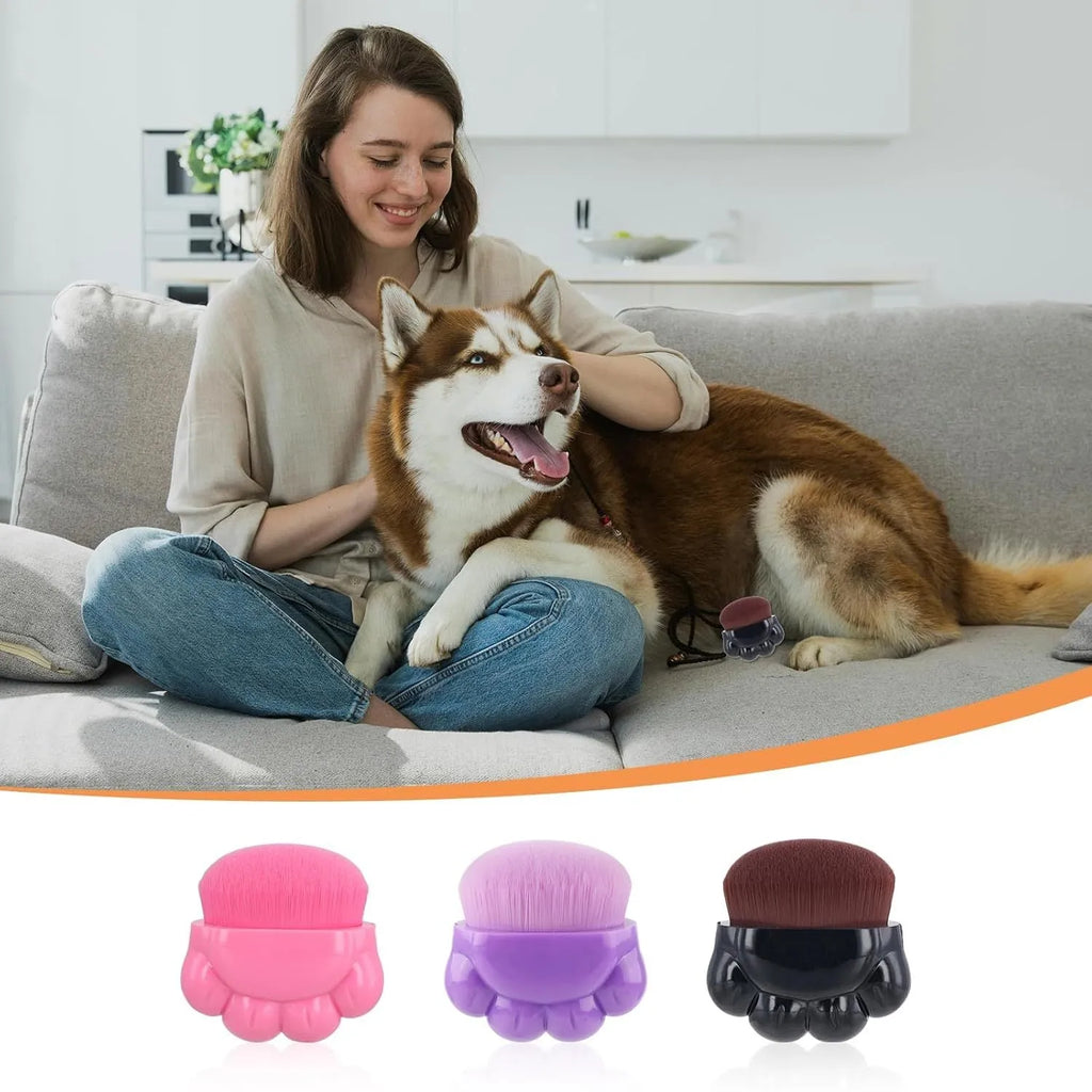 Three paw-shaped pet balm brushes with soft fibre heads in plastic storage boxes
