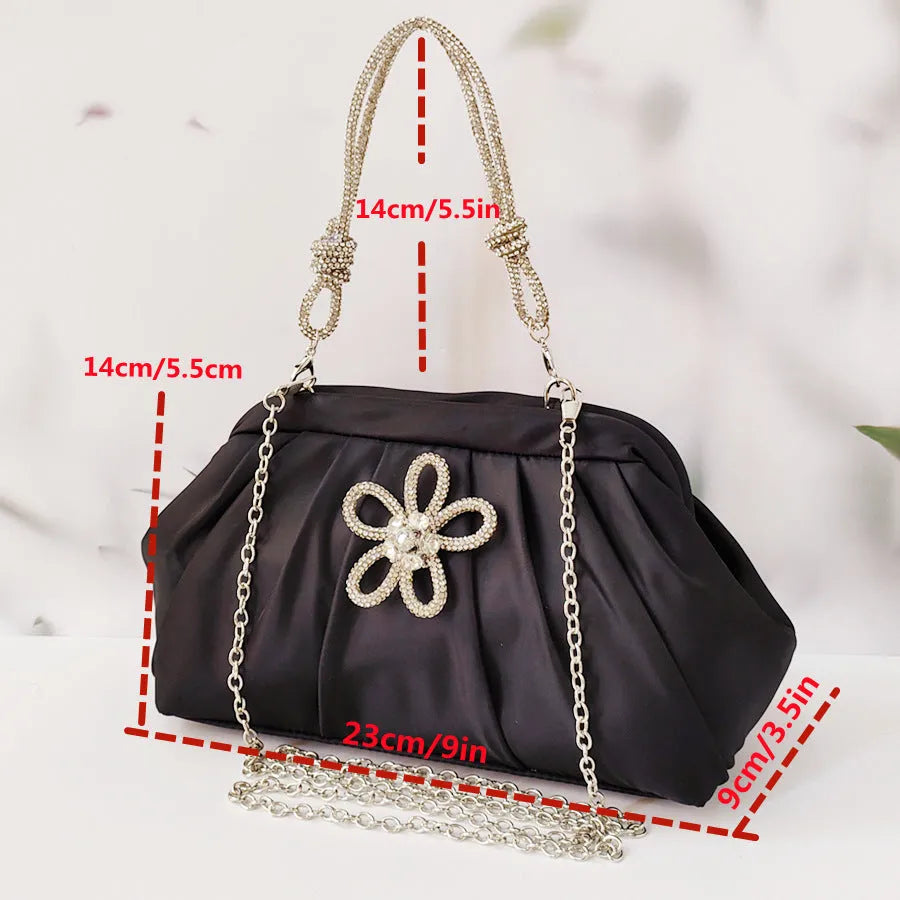 Soft black women's large-capacity dinner bag with chain strap and shell shape.