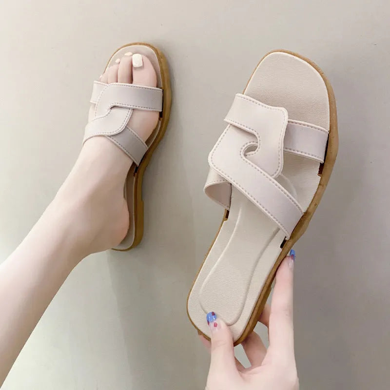 Women's cross strap PVC sandals in light blue, showing toe ring and non-slip sole.
