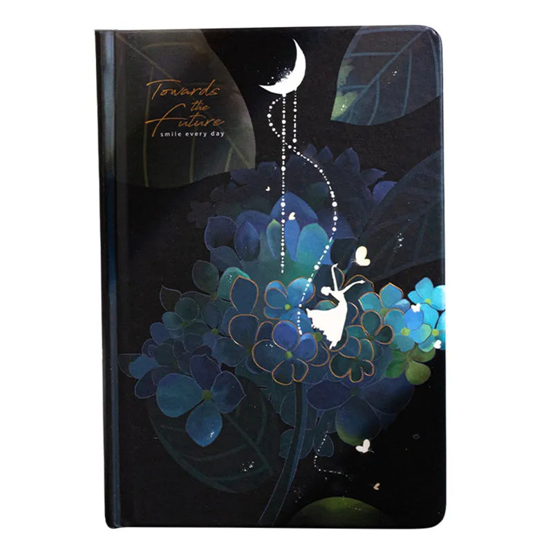 A5 hardback notebook with luminous cover open to show colour illustrated pages.
