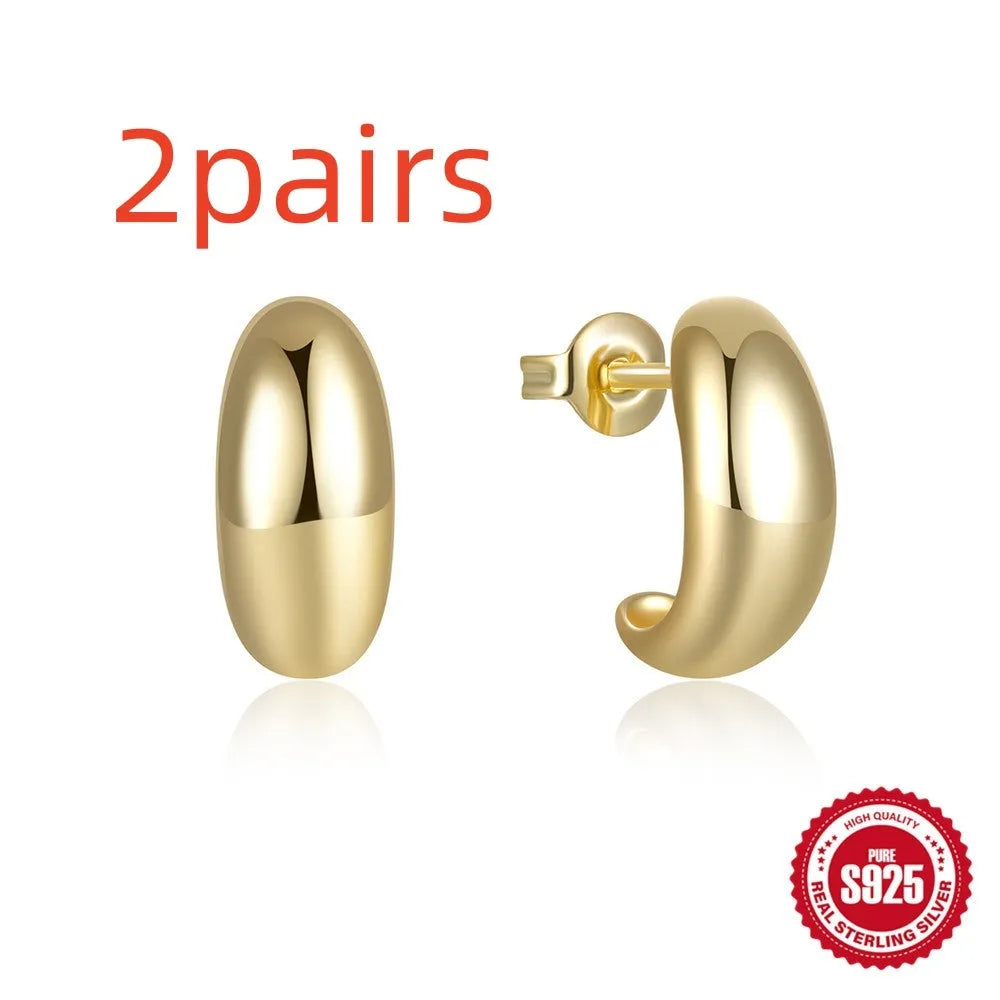 C-shaped sterling silver stud earrings with electroplated gold finish and post backing