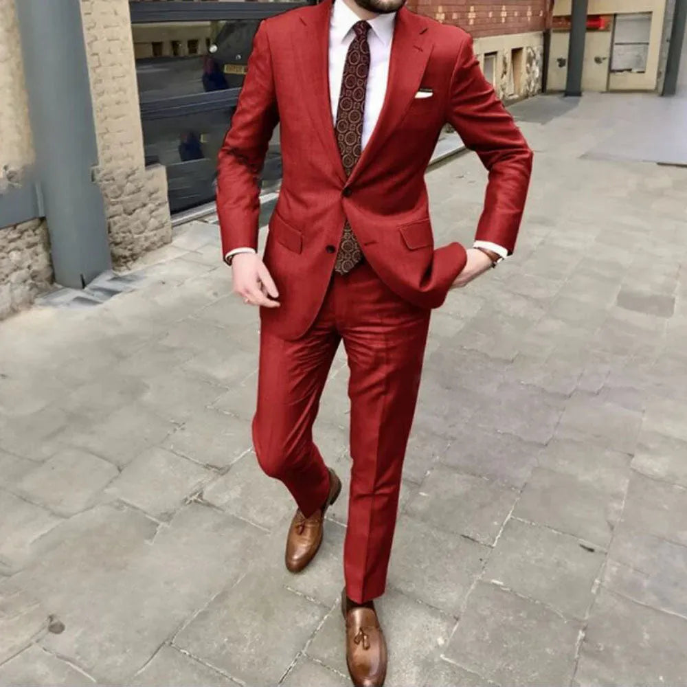 Men's slim fit two-button business suit jacket and trousers on a hanger
