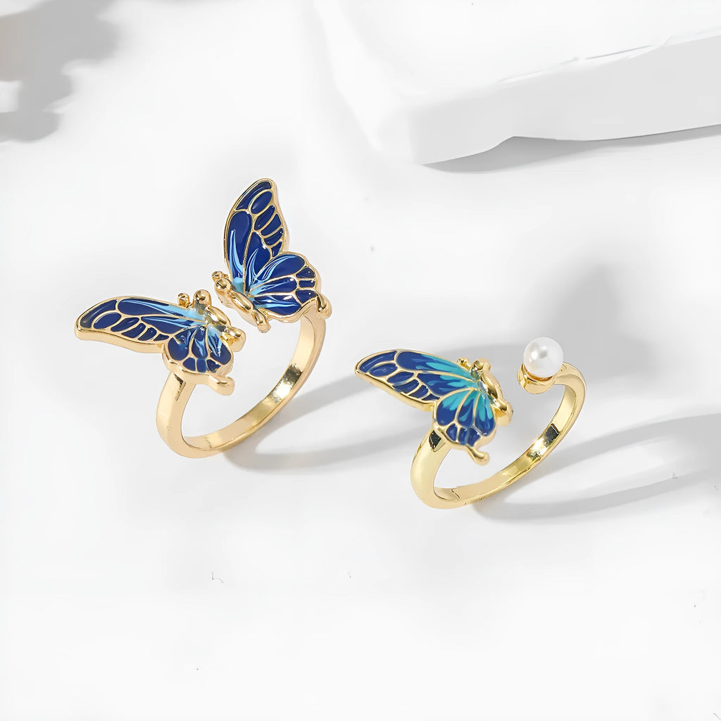 Butterfly-shaped pearl ring in imitation gold on adjustable alloy band