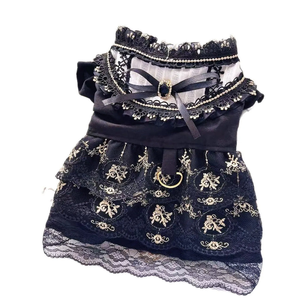 Golden gothic-style layered skirt for a small dog or cat on a mannequin, showing adjustable velvet collar.