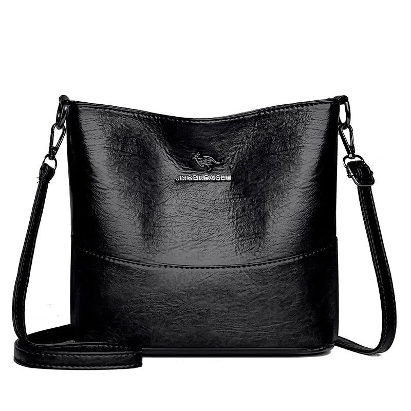 Women's soft leather bucket shoulder bag in black with sewing line detailing and mobile phone pocket