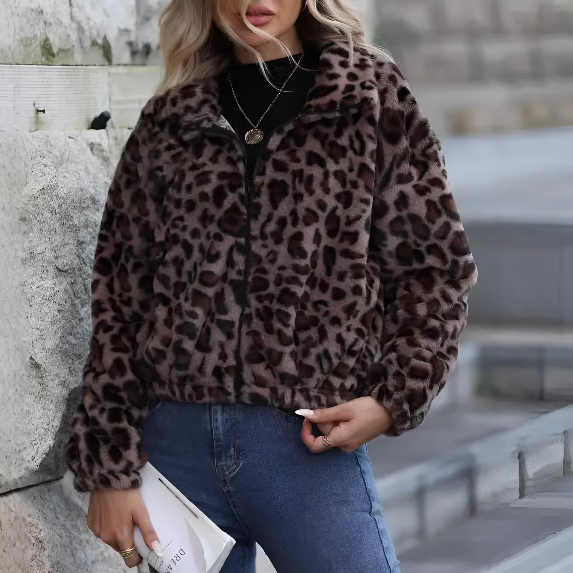 Women's loose fit leopard print plush coat with front zip and raglan sleeves.
