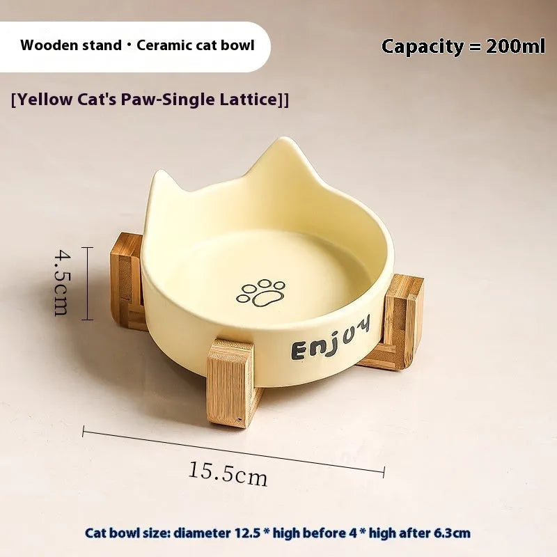Porcelain cat bowl with cat ear and paw design on a wooden feeding frame, in pink colour.