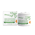 White tube of Skin Soothing Repair Cream with botanical ingredients mint honey aloe on clean background