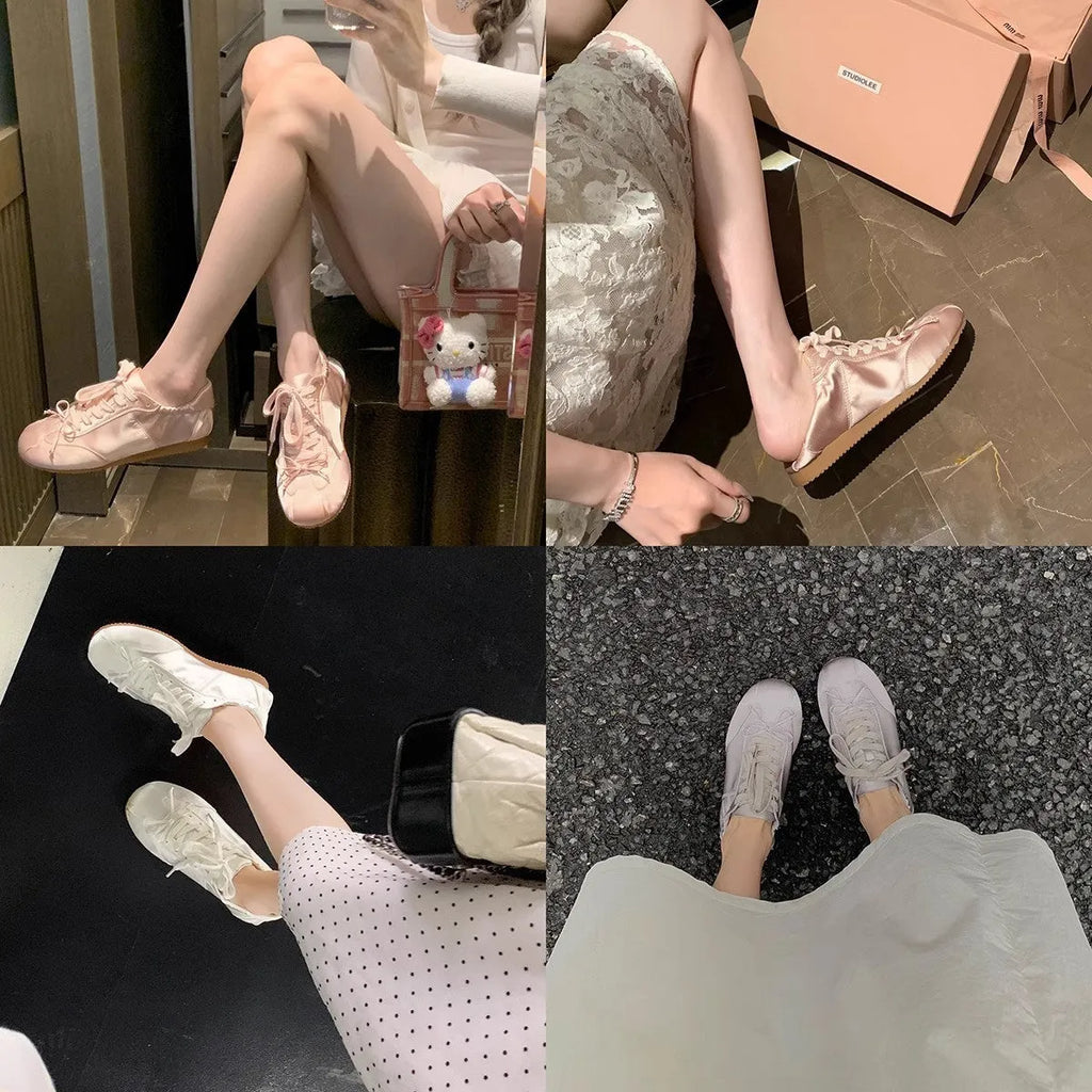Women's satin ballet flats in champagne pink with round toe and front lace-up closure.