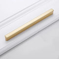 Gold aluminium alloy T-shape cabinet door handle with single-hole fitting.