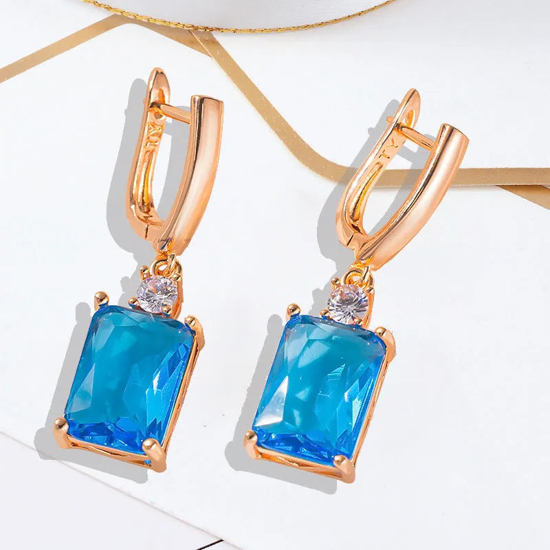 Square quadrilateral geometry earrings with electroplated gold or silver finish on copper construction