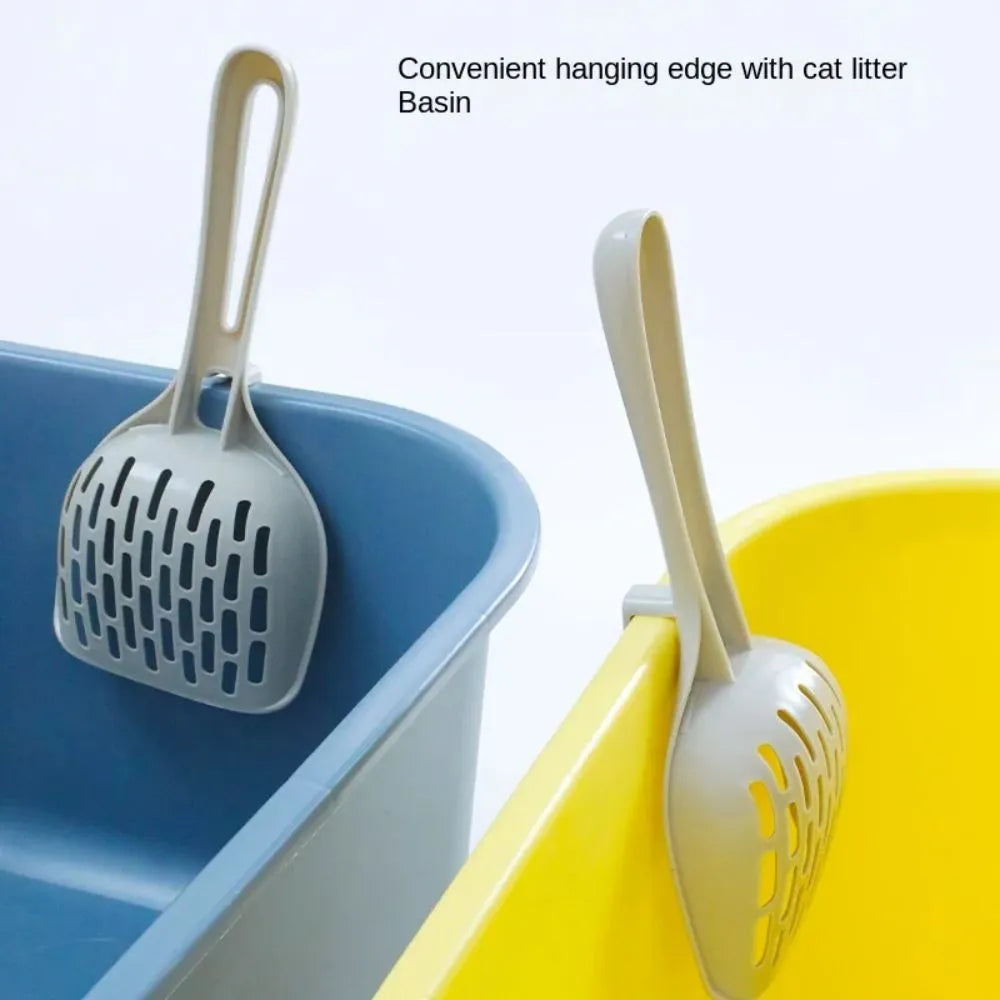 Grey plastic cat litter scoop with detachable base stand showing drainage slots