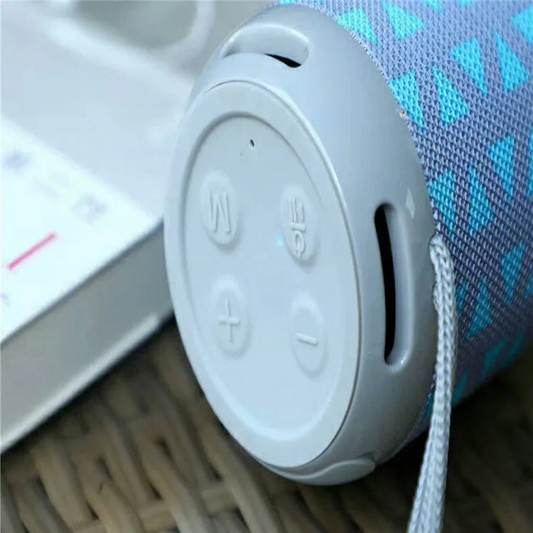 Wireless Bluetooth speaker in black, compact design with buttons and speaker grille, 73.4mm size