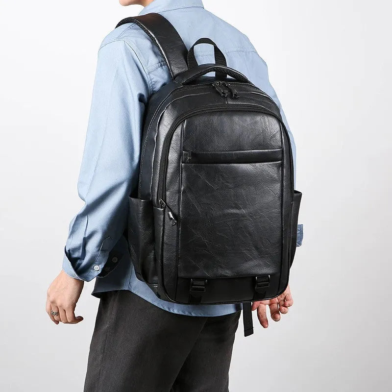 Men's large capacity PU backpack in khaki, 47x33x18cm, with curved shoulder straps and main compartment opening