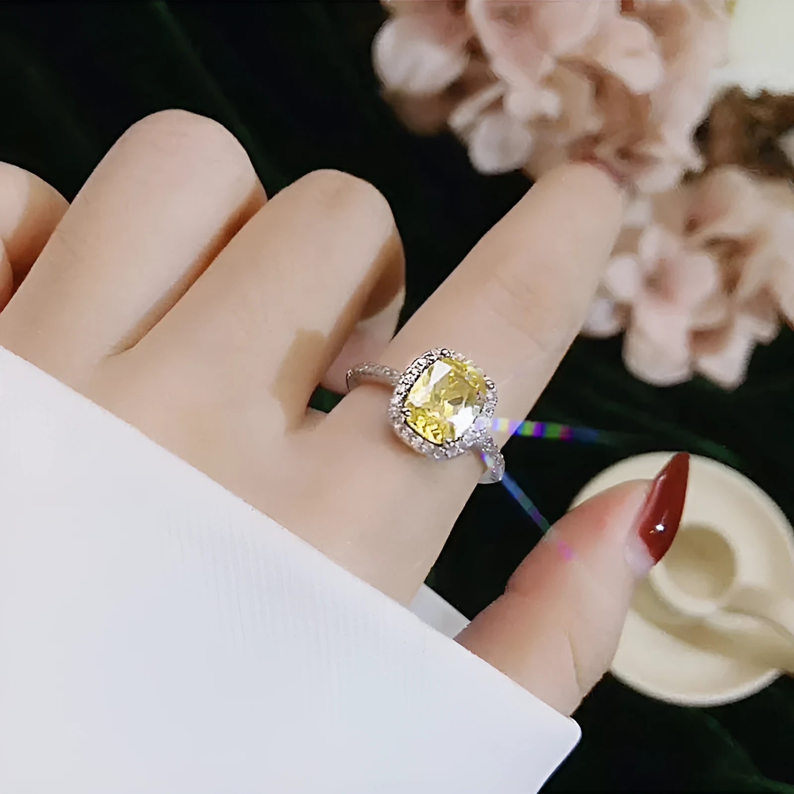 Silver alloy women's ring with artificial gemstone geometric design on white background