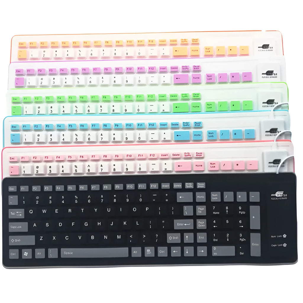 Folding silicone keyboard in pink with USB cable, placed on a desk