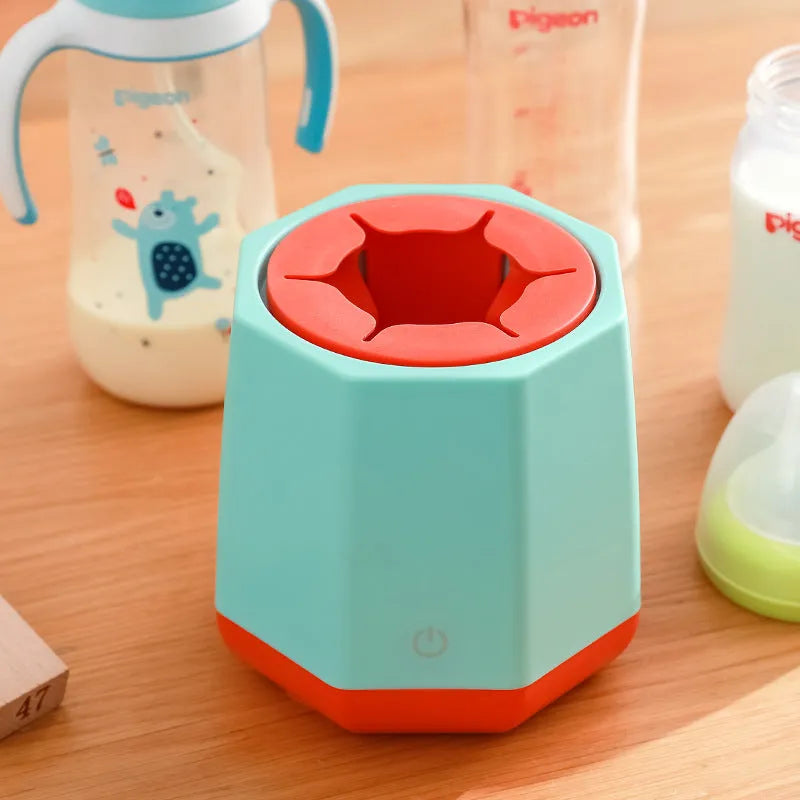 White baby electric milk shaker with silicone slot holding a baby bottle on a table, 110x110x110mm size