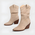 Women's thick heel ankle boots in brown with belt buckle detail and pointed toe