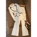 White polyester women's formal suit set with blazer top and matching trousers