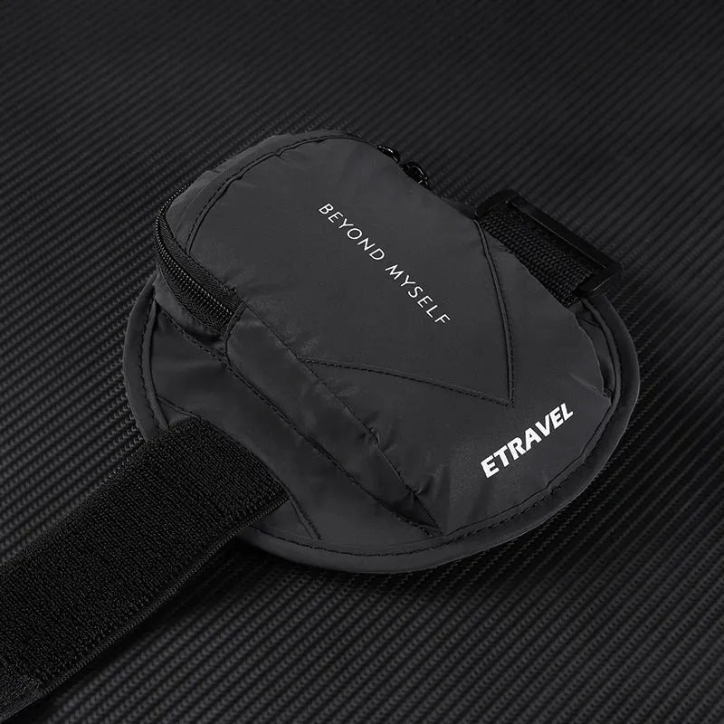 Black reflective running arm bag with adjustable strap, holding a mobile phone, shown on a runner's arm.