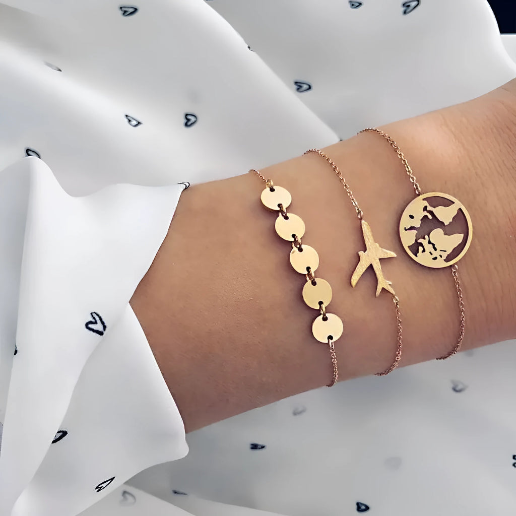 Three women's charm bracelets with heart-shaped aircraft map pendants in alloy with electroplated finish