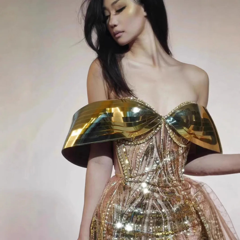 Gold strapless sequined dress with tulle skirt split, showing front and back views
