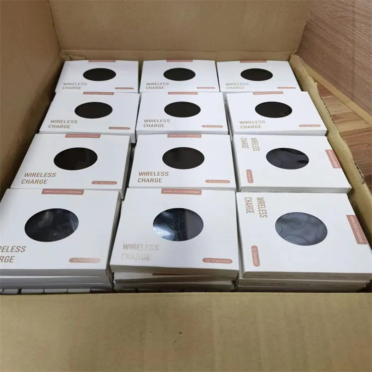 Black 15W fast wireless charger pad with type C cable on a desk