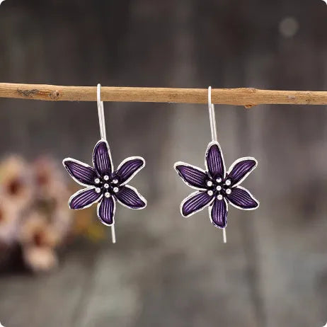 Purple flower-shaped alloy earrings with electroplated finish