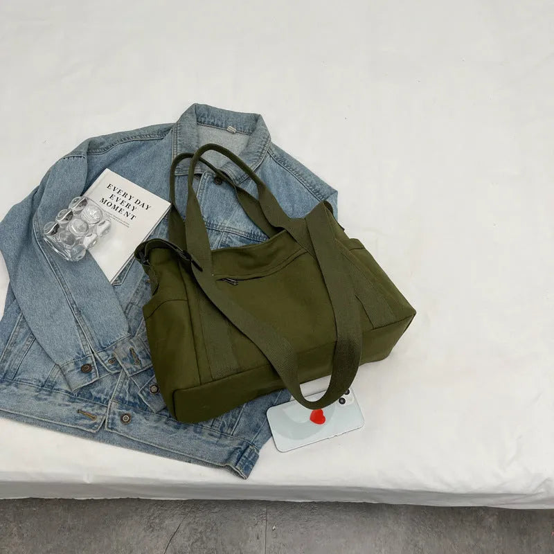 Large solid colour polyester shoulder tote bag with external pocket and internal phone compartment