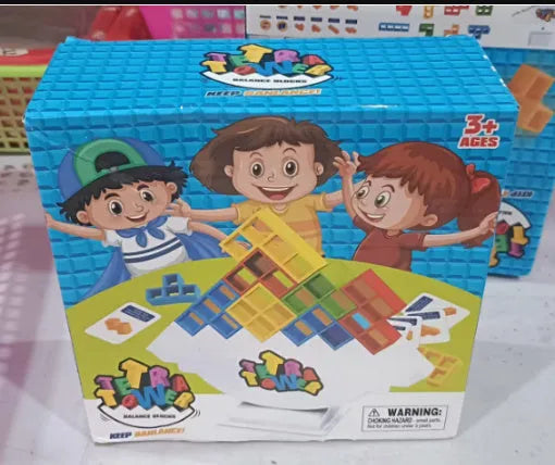 Plastic balance stacking board game with 16 coloured blocks, chassis, and base on a 26.5cm square box.