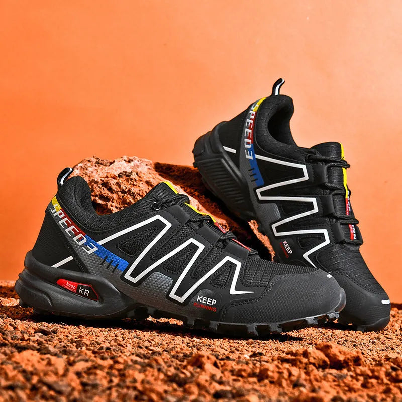 Men's grey orange and dark blue casual running shoes with low-top design on a white background.