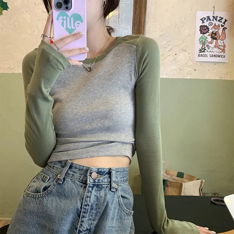 Dark blue oversized ladies top with long princess sleeves and a short hem.