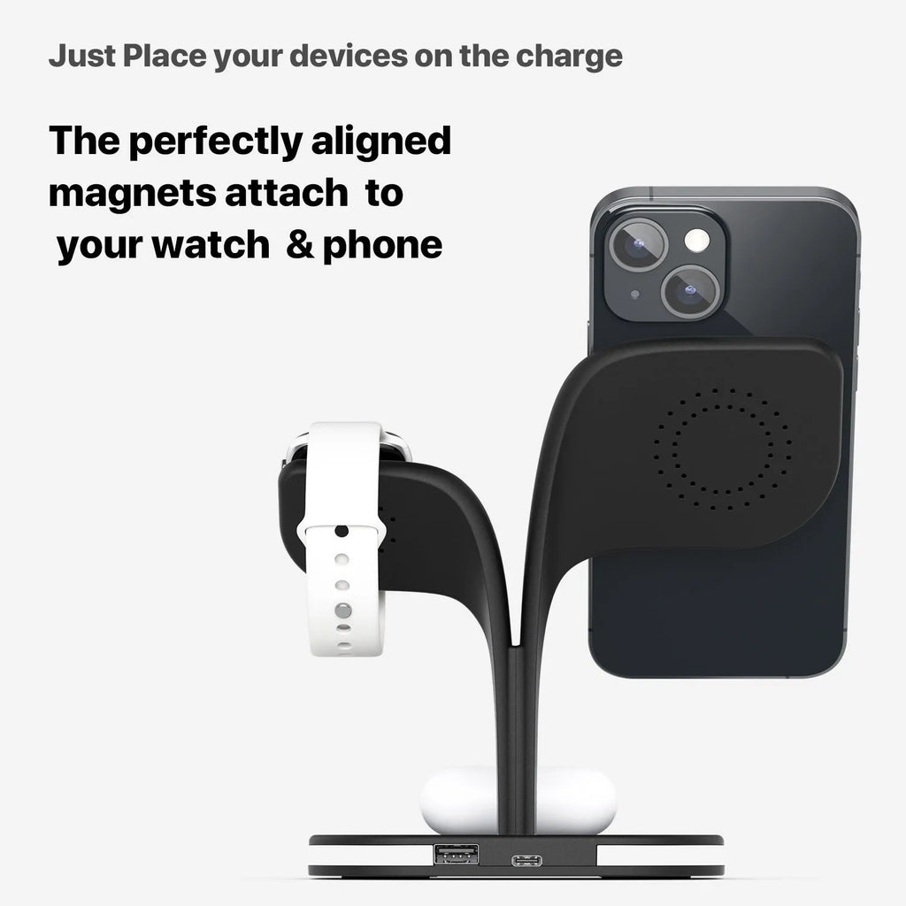 Black 3-in-1 wireless charging station holding a phone, smartwatch, and headphones on a desk.