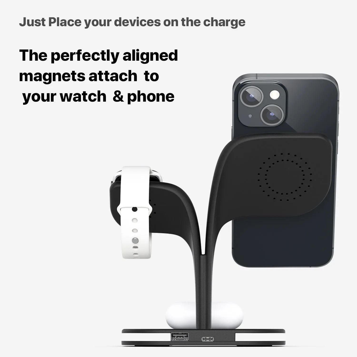 Black 3-in-1 wireless charging station holding a phone, smartwatch, and headphones on a desk.