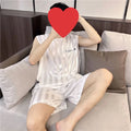 Men's ice silk pyjama set with sleeveless vest and shorts in white, black, or grey.