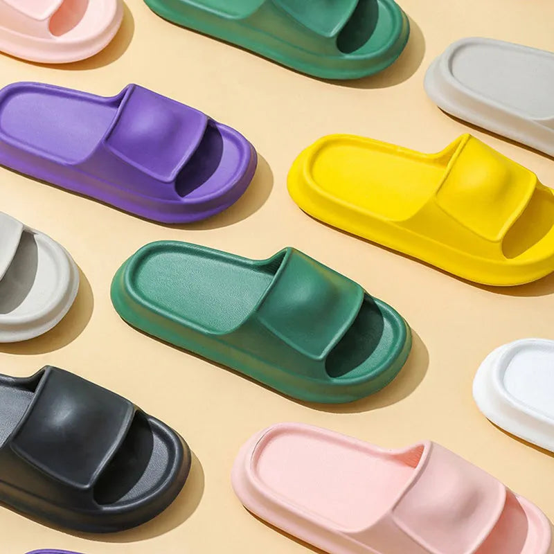 Pair of thick-soled EVA flip-flop slippers in a chosen colour on a plain background.