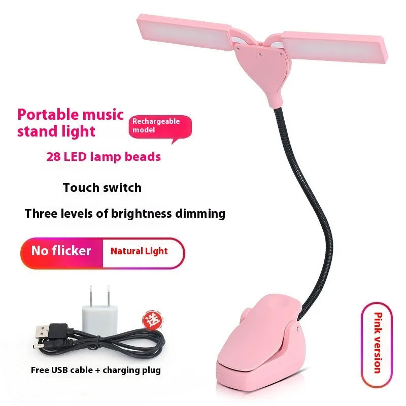 Black rechargeable music stand lamp with 28 LED bulbs lit up on a music stand.