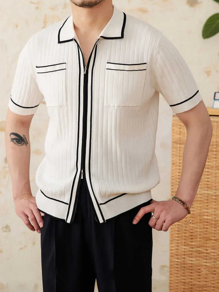 Man's slim fitting short sleeve polo shirt with a lapel collar in black, made from a lightweight knitted fabric.