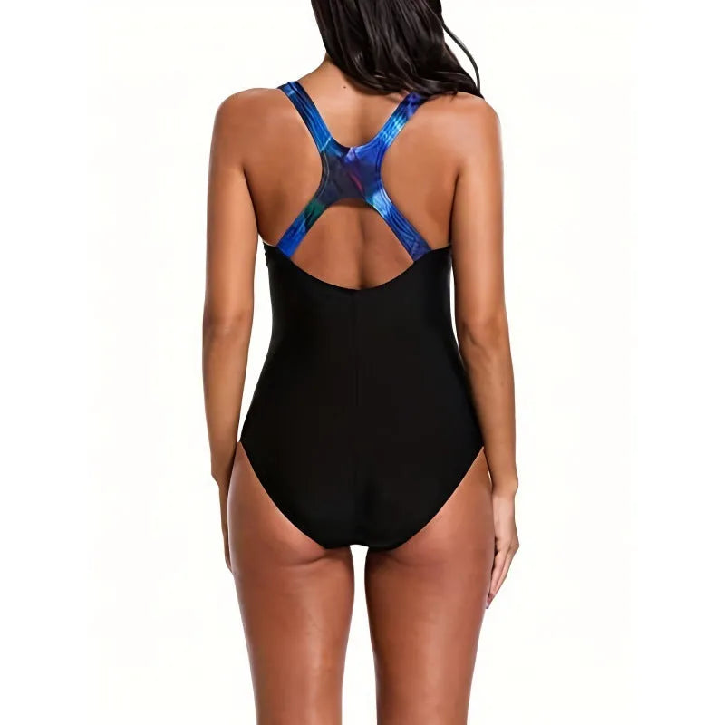 Women's oversized floral print one-piece swimsuit with backless design on a mannequin.