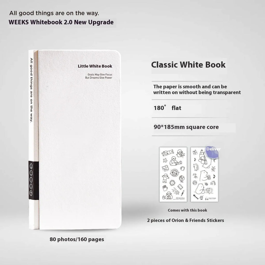 Small white paper notebook with plaid pages, mesh cover, and a pair of decorative stickers.