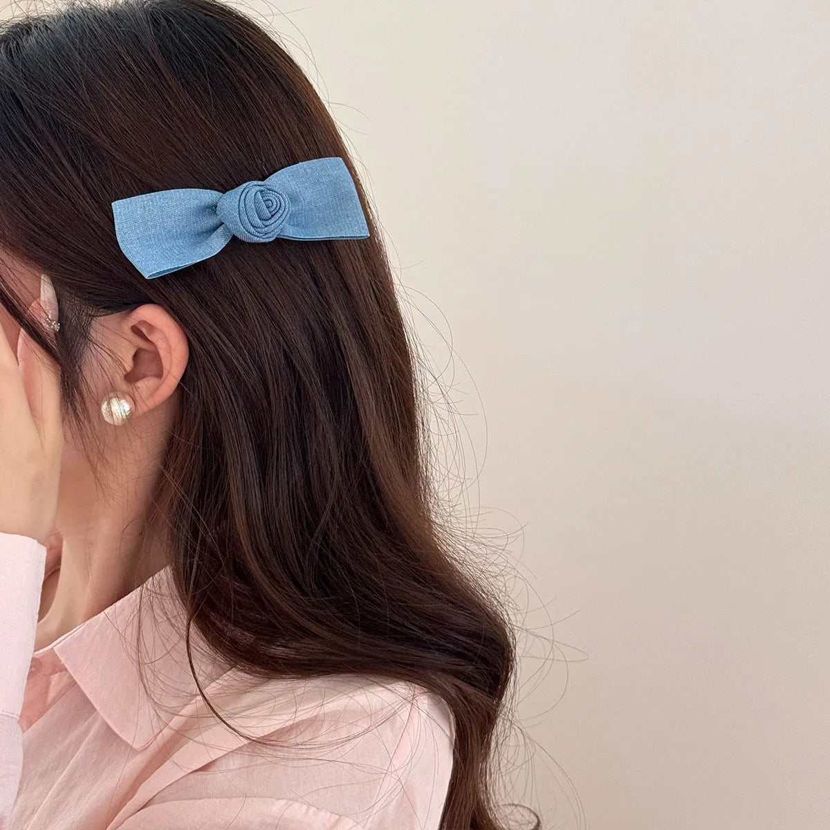 Handmade pastoral style cloth hair barrette with lace and bow decoration on a plastic hairpin.