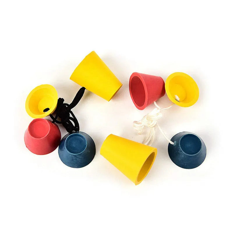 Set of four rubber golf tee ball holders in blue, yellow, and red with four feet each, 2cm height