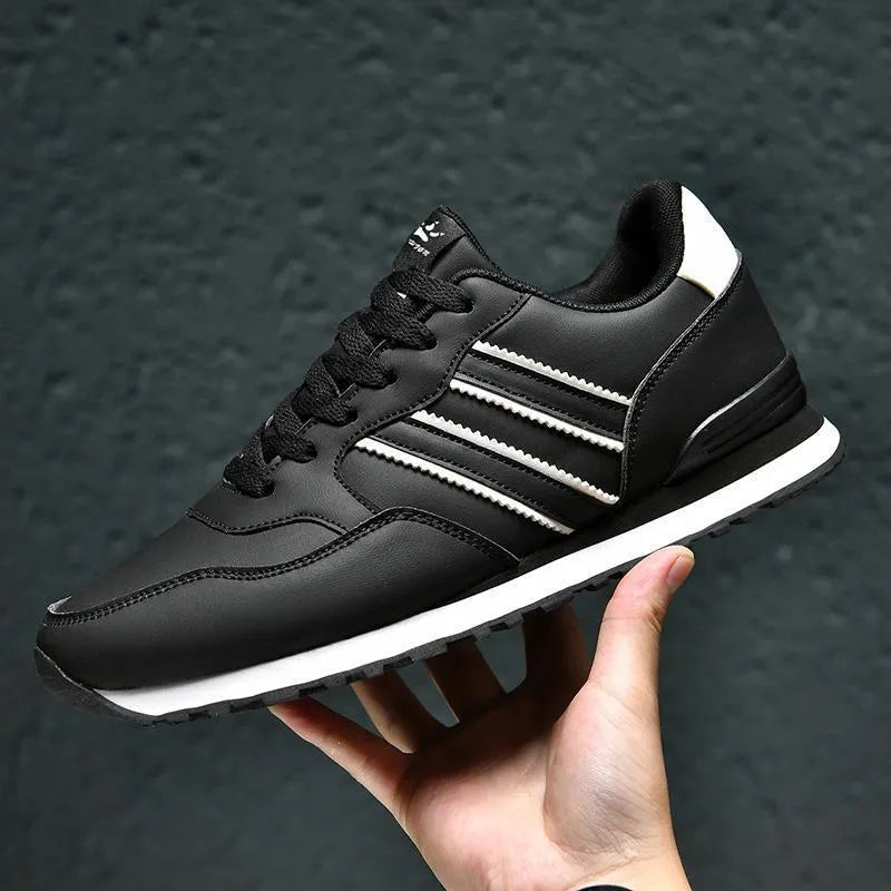 Men's black casual running shoes with white carved wing pattern on the side and a high heel.